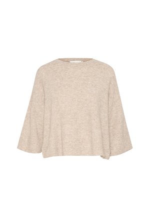 Beige oversized neulepaita, joka on valmistettu pehmeästä, rakenteellisesta kankaasta. Siinä on pyöreä pääntie ja leveät hihat, sekä rento, lyhyt leikkaus.