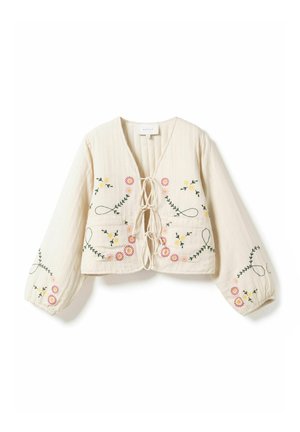 Kremowa bluzka z długim rękawem, krótka, z wiązaniami z przodu oraz kwiatową haftowaną dekoracją w kolorach różowym, żółtym i zielonym na piersi i rękawach.