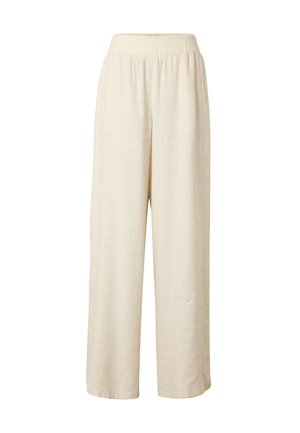 Pantaloni larghi color crema con vita elastica e tasche laterali, realizzati in tessuto leggero.