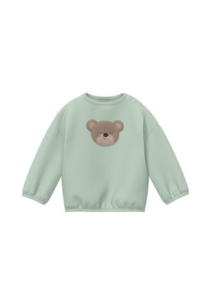 Light green long-sleeve baby sweater with elastic cuffs and a teddy bear face patch on the chest, plus two buttons on one shoulder.