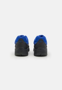 Black and blue athletic shoes featuring a breathable mesh upper, textured rubber sole, and a padded collar for support.
