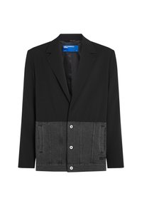 Crni sako s donjim panelom od sive trapere. Ima rever, prednje gumbe i bočne džepove. Glatka tekstura na vrhu, teksturirana traperina dolje.