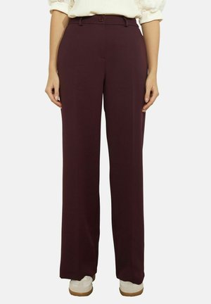 - Spodnie materiałowe