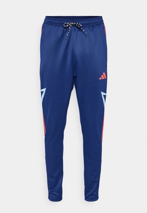 Navy blue athletic pants with black and white drawstring, red and light blue geometric accents, and a small red logo on the right thigh.