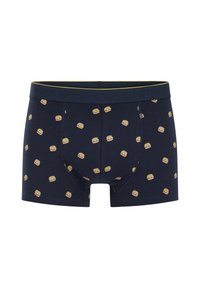 Tengerészkék boxeralsó, pamutból készült, ismétlődő hamburger mintával. Rugalmas derékpánt, amelyen a "BUNS OF STEEL" felirat van gravírozva.