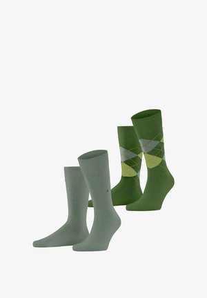 Cztery pary zielonych skarpetek: dwie jednolite jasne zielone oraz dwie ciemnozielone z diamentowym wzorem w żółtym i jasnym zielonym akcentem.