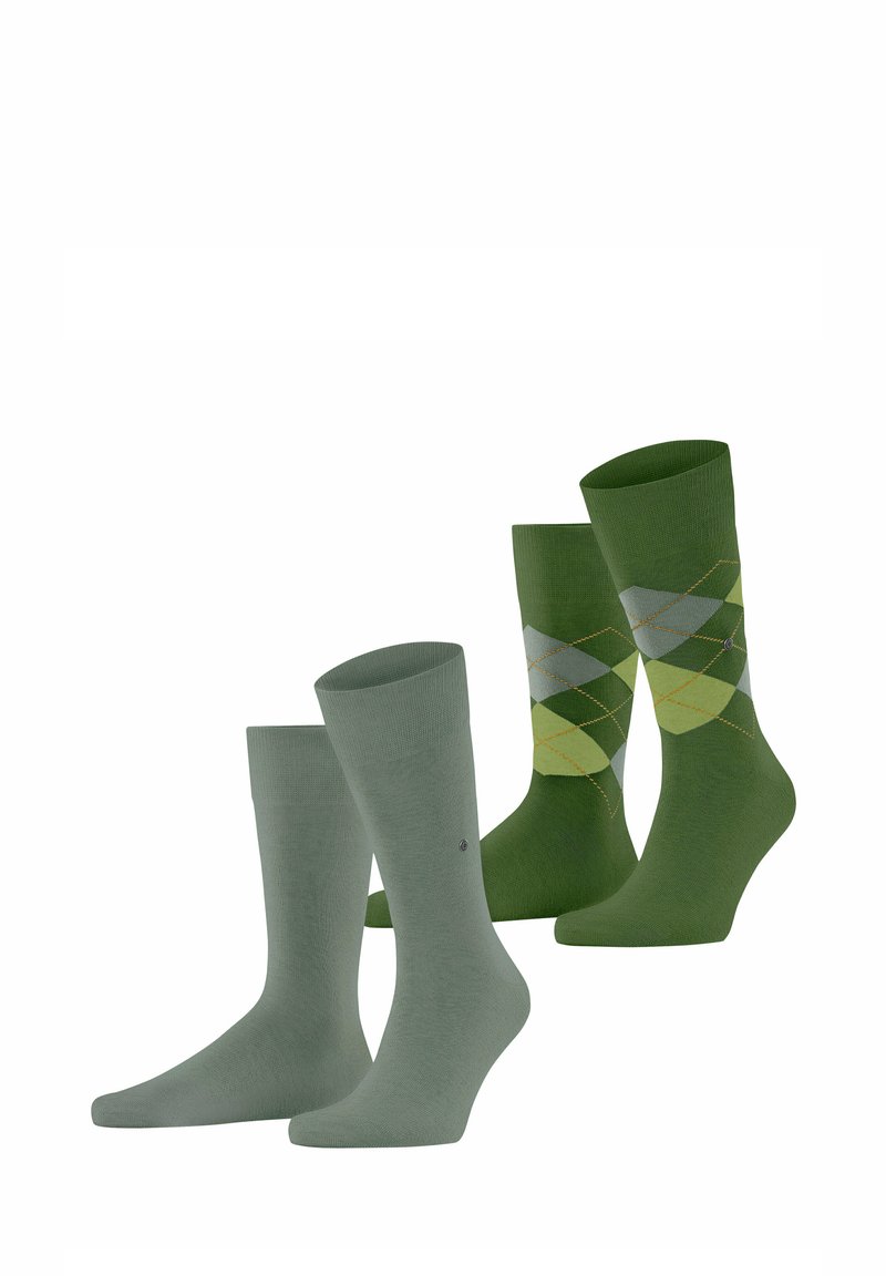 Vier Paare grüne Socken: zwei einfarbig hellgrün und zwei dunkelgrün mit einem Rautenmuster in gelb und hellgrünen Akzenten.