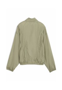 Veste vert olive clair à la coupe décontractée, avec un ourlet élastique et des manches raglan. Confectionnée dans un matériau lisse et léger avec des détails de couture.