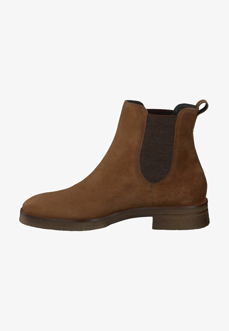 Stivale in suede marrone alla caviglia con pannelli laterali elastici, punta arrotondata e tacco basso impilato. Caratterizzato da un tassello per una facile calzata.