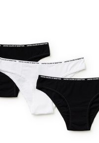 Zwarte en witte katoenen slipjes met een elastische tailleband met de tekst "UNITED COLORS OF BENETTON." Glad textuur en een klassiek slipdesign.