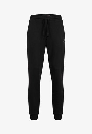 Svarte slim-fit joggebukser med elastisk midje, snor, ribbestrikkede mansjetter og lite hvitt logo på venstre lår.