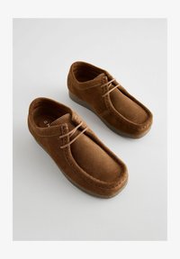 Sélectionné, tan brown