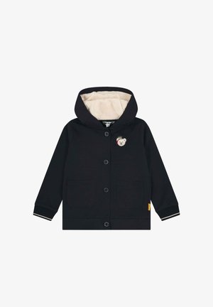 Granatowa kurtka z kapturem, z miękką beżową podszewką, posiadająca dwie przednie kieszenie oraz motyw misia na piersi. Zapięcie na guziki i ściągacze przy mankietach.