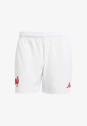 White athletic shorts made of smooth fabric featuring a red rooster emblem on the left leg and red Adidas stripes on the lower right side.
