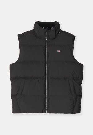 Chaleco de plumas negro con cuello alto, cierre frontal de cremallera y bolsillos laterales. Presenta un diseño acolchado y un pequeño logo en el pecho.