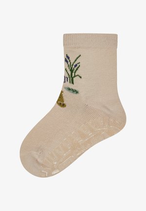 Beige sock with ribbed cuff, featuring embroidered green grass and blue flowers, textured snug fit with reinforced toe and heel.