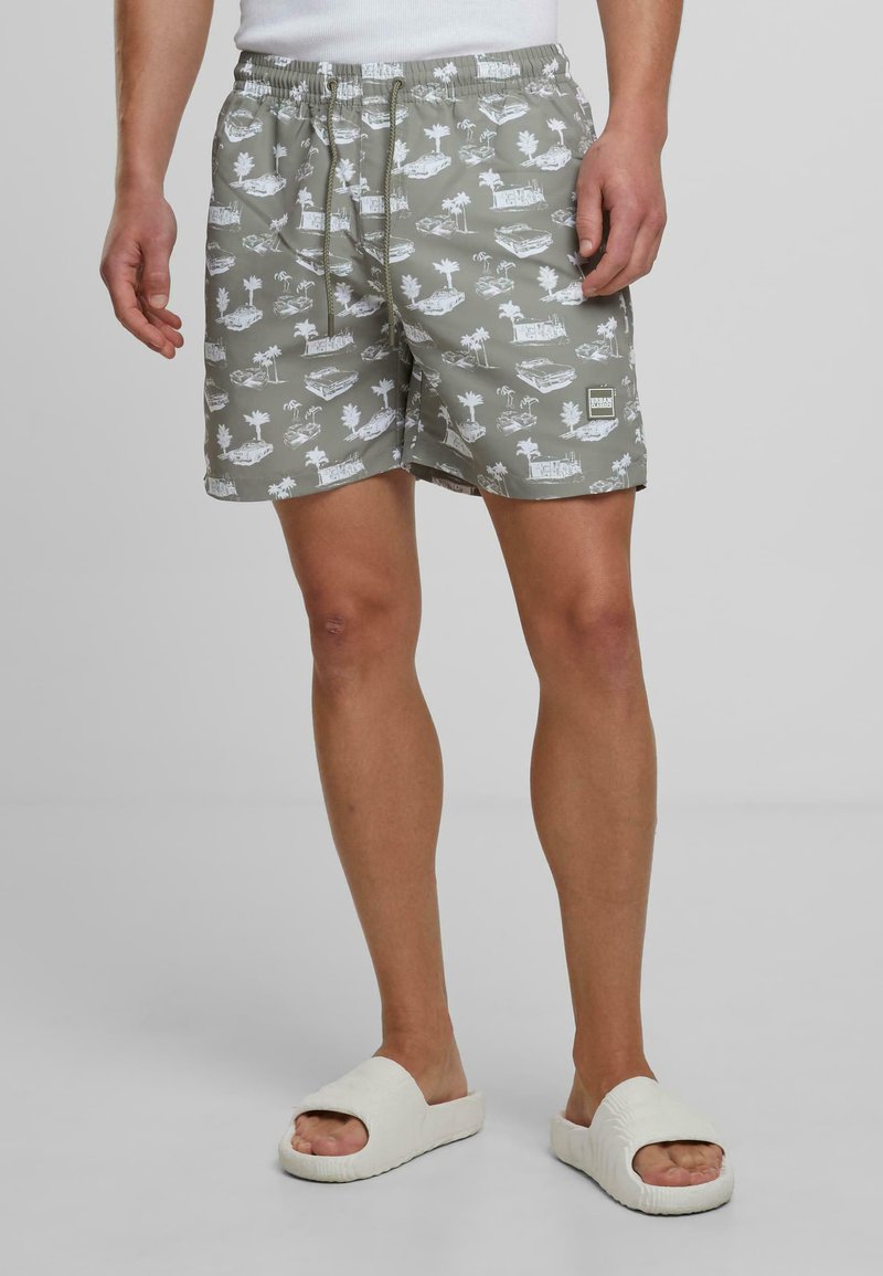 Pantaloni scurți de baie pentru bărbați în gri deschis, cu un model tropical alb. Au o talie elastică cu șnur și un croi drept.