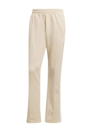 Pantaloni da jogging in poliestere beige con gamba affusolata, vita elasticizzata e strisce laterali bianche; presenta dettagli del logo bianco.