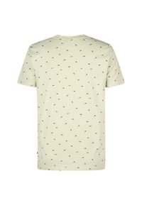 Světle žluté bavlněné tričko s rozptýleným vzorem malých hnědých a zelených ptáků. Krátké rukávy a uvolněný střih.