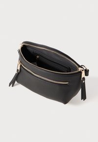 Black leather pouch bag featuring gold-tone zippers, an outer zip pocket, and a textured finish. Interior includes card slots and pockets.