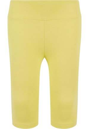 Sárga sportleggings sima textúrával, combközép hosszúságú és varrás nélküli derékpánttal, a kényelem és rugalmasság érdekében tervezve.