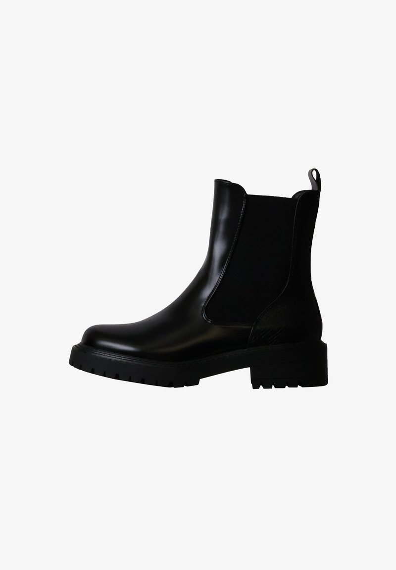 Bottine Chelsea en cuir noir avec panneau latéral élastique, semelle à crampons, petit talon et languette à l’arrière.