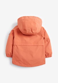 Vaalean oranssi huppari, jossa on elastiset hihat, suoraleikkauksellinen malli, takakappale ja sileä pinta. Ei näkyviä kiinnityksiä tai kuvioita.