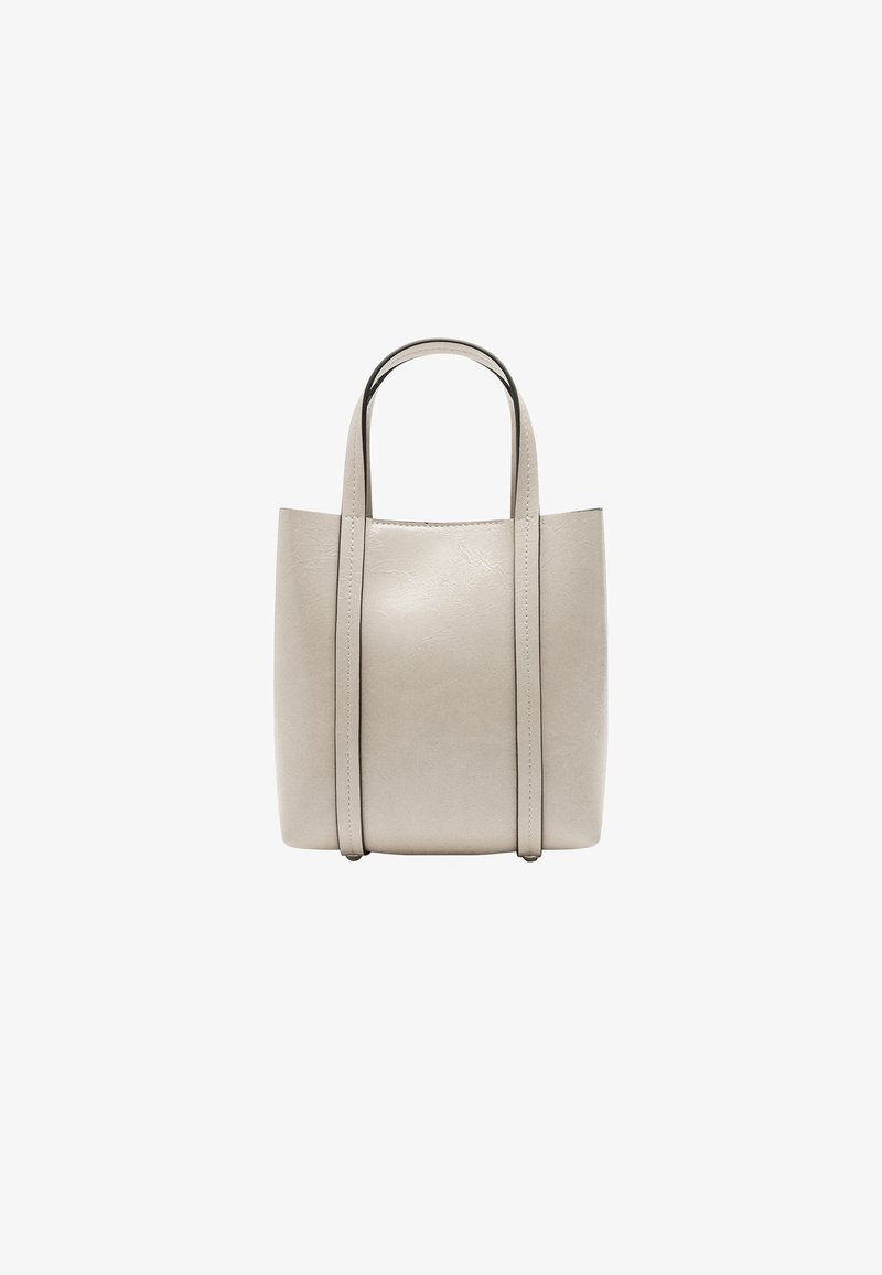 Beżowa torebka na ramię z wegańskiej skóry, z dwoma uchwytami, prostokątny kształt, gładka tekstura oraz detale szycia wzdłuż krawędzi.