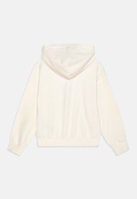 Felpa color crema con una texture morbida, dotata di cappuccio, maniche lunghe e orlo a coste. Tessuto liscio senza motivi o accenti visibili.