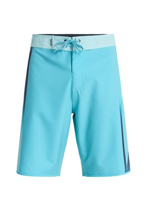 Costume da bagno turchese realizzato in materiale leggero, con cintura elastica e coulisse, e dettagli laterali blu scuro.