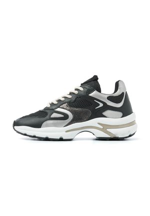 Black and silver sneaker with mesh and leather materials, lace-up design, contrasting textures, and a thick white sole with gold accents.