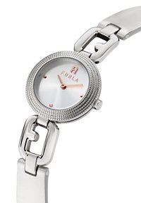 Hõbedane metallkell tekstuurse äärisega, valge dial, roosakullast aksessuaarid kätes ja logo, kinnitatud siledale käevõrule.