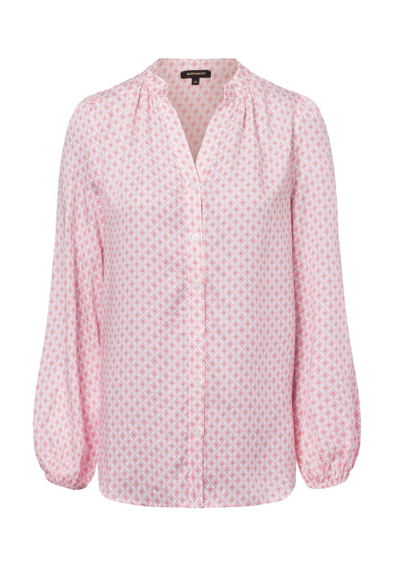 Light pink blouse with a diamond pattern in darker pink. Features a button-up front, long sleeves, and gathered texture at the neckline.