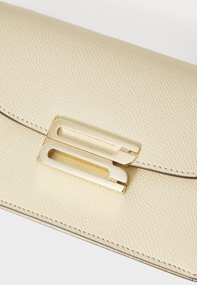 Victoria Beckham BBUCKLE NANO - Cross body bag - ivory