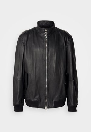 Black leather jacket with front zipper, snap button collar, side pockets, and ribbed cuffs and hem, displayed on a plain background.