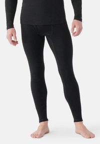 Svarta långa leggings i stretchtyg, med en åtsittande passform och slät textur samt förstärkta sömmar för hållbarhet.