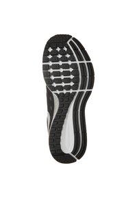Suela de zapatilla para correr en blanco y negro con patrones y surcos diseñados para tracción y flexibilidad.