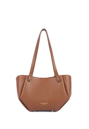 Sac à épaule en cuir marron avec longues bretelles, côtés arrondis, détail anneau doré et logo "Lancaster Paris" sur le devant.