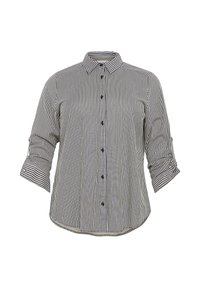Chemise à manches longues rayée verticalement noir et blanc, boutonnée, avec col et poignets retroussés.