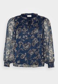 Blusa floreale navy realizzata in tessuto trasparente con maniche a sbuffo e scollatura arricciata. Presenta motivi floreali argentati e polsini elasticizzati.