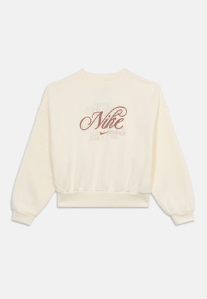 Bluză cu mâneci lungi, de culoare crem, cu tiv și manșete elastice, având un logo mare "Nike" scris cursiv și text estompat pe partea din față.