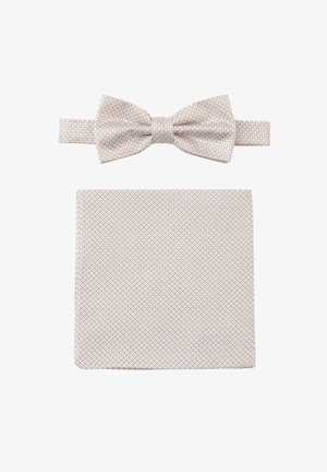 Beige patterned bow tie with a matching pocket square, both made of textured fabric featuring a geometric design.