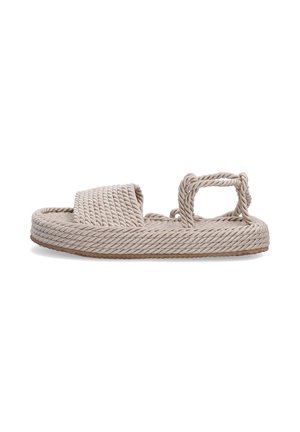 Braided rope sandals in light beige with a flat sole, featuring a wide strap and a small loop at the heel for added support.