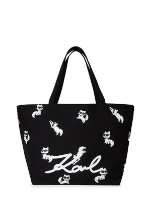Geantă de umăr neagră cu leițe albe de vulpi desenate și numele "Karl" scris cu litere albe îngroșate. Confecționată dintr-un material durabil, cu bretele robuste pentru umăr.