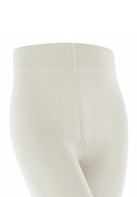 Leggings color beige chiaro con una texture morbida ed elasticizzata. Presentano una vita larga e a coste e cuciture lisce per un comfort ottimale.