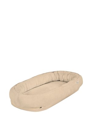 Soft beige pet bed with raised, cushioned sides and a zippered cover, designed for small to medium-sized pets.