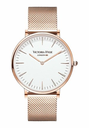 Hodinky s růžově zlatým síťovaným páskem, bílým ciferníkem, minimálními hodinovými značkami, dvěma ručičkami a značkou "Victoria Hyde London".