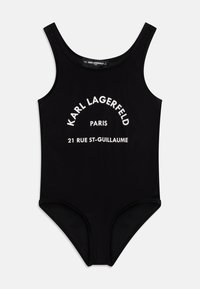 Fato de banho preto em uma peça com decote redondo e pernas de corte alto. Texto branco lê-se "KARL LAGERFELD PARIS 21 RUE ST-GUILLAUME." Textura suave.
