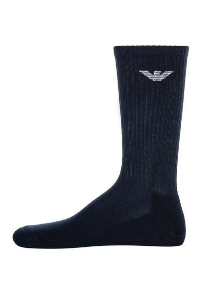 Mornarsko modre rebraste nogavice z ojačano točko in peto. Imajo majhen bel logotip blizu vrha na zunanji strani.