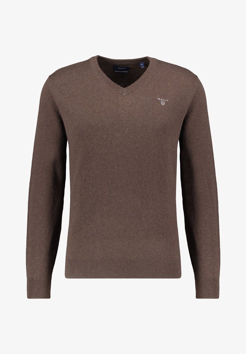 Brauner V-Ausschnitt-Pullover aus weichem, strukturiertem Stoff. Mit langen Ärmeln und einem kleinen Logo auf der Brust. Klassische Passform.